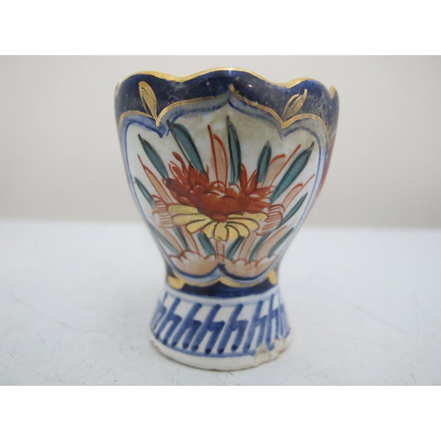 Very sweet Delft Holland Imari style porcelain egg cup with scalloped rim. Hand painted floral design in cobalt blue, red,...
