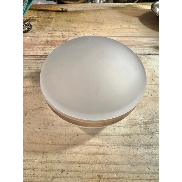 This is a vintage domed, covered frosted satin glass vanity powder bowl with a gold band. A very unique piece of vintage...