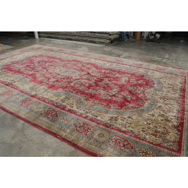 Handwoven in wool, this 11x22 antique Persian Kerman rug originating circa 1920-1930, is a masterpiece from one of the...