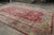 Handwoven in wool, this 11x22 antique Persian Kerman rug originating circa 1920-1930, is a masterpiece from one of the...