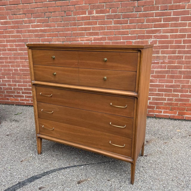 Part of Broyhill’s Forward collection, this vintage highboy dresser features a warm walnut finish with softly rounded...