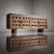 Sculptural and severe, this 1960s Spanish credenza commands attention through its deeply articulated geometric facade....