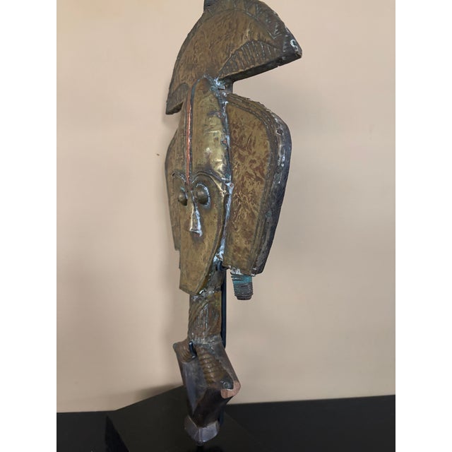 20th Century African kota Reliquary figure from Gabon . This unique figure is made from wood, brass and copper. It shows...