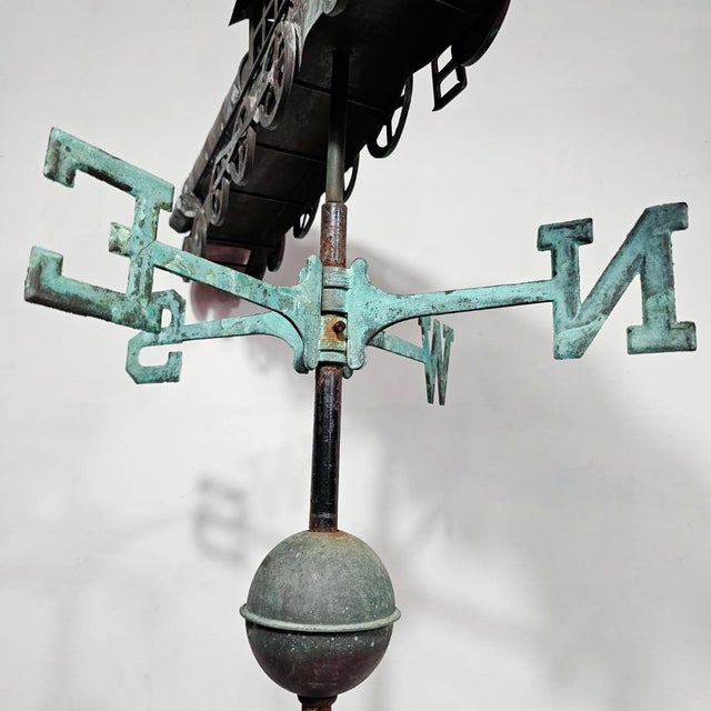 A very rare weather vane, modeled after the first steam locomotive, made of copper with a fantastic patina and in...