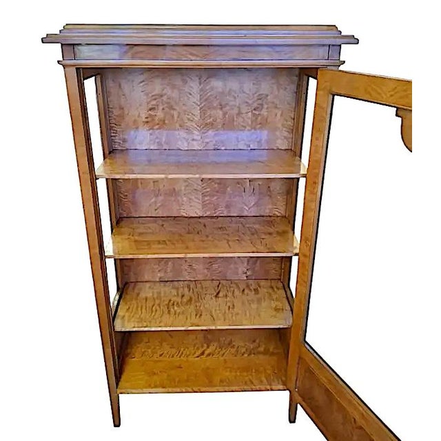 Stunning Biedermeier-style tiger maple veneered vitrine. Features a glass door and glass gallery sides, four wood shelves,...