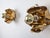 Pair of Hans Kogl wall sconces in gold-plated metal, designed in his signature open flower shape. Each piece features...