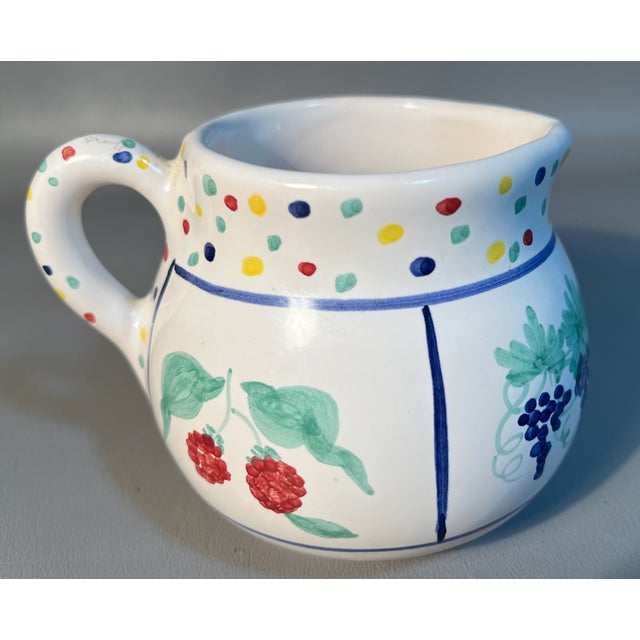 Made to surprise and delight, this hand decorated sugar with lid bowl & creamer set is just plain cutesie cool. Adorned...
