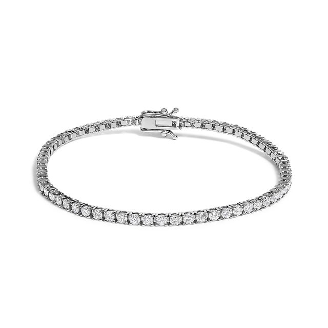 Introducing a timeless symbol of elegance: a stunning tennis bracelet crafted in lustrous 14K white gold. This exquisite...