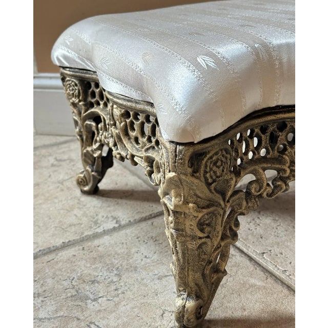 This Victorian-style cast iron footstool blends antique charm with modern sturdiness. Unmarked but likely made within the...
