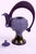 This stunning decorative teapot features a soft lavender body adorned with intricate raised floral patterns, giving it a...