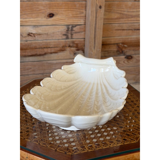 A beautiful vintage shell-form centerpiece bowl by Abingdon Pottery, featuring an elegant white glazed finish and...