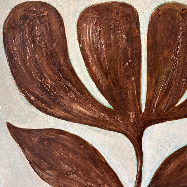 A strikingly graphic and sculptural original painting featuring an oversized tulip rendered in rich chocolate brown...