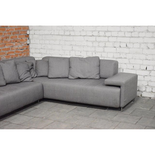 Comfy corner sofa by Patricia Urquiola for Moroso, Italy. Stands on metal legs. Fabric remains with age and usage marks....