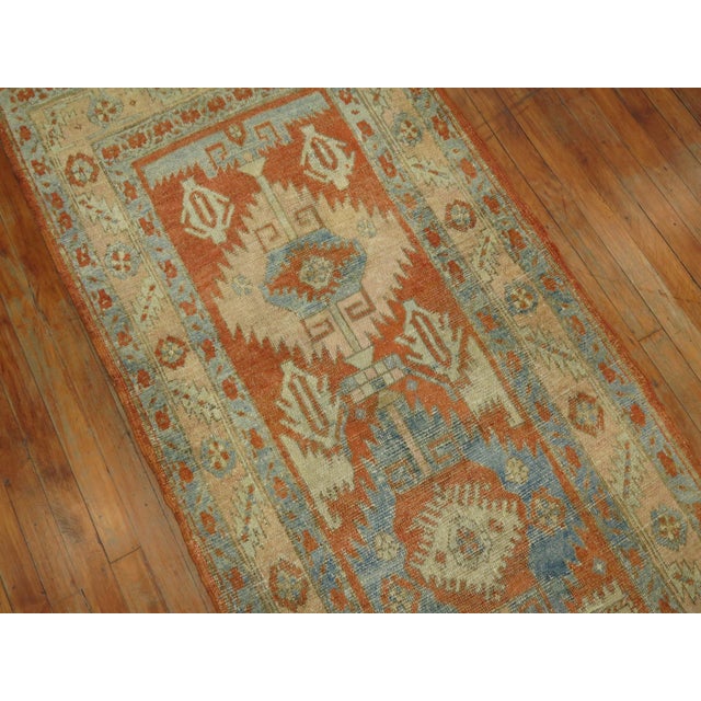 A long Persian Heriz geometric antique runner from the early 20th Century Measures: 2'10'' x 15'5''.