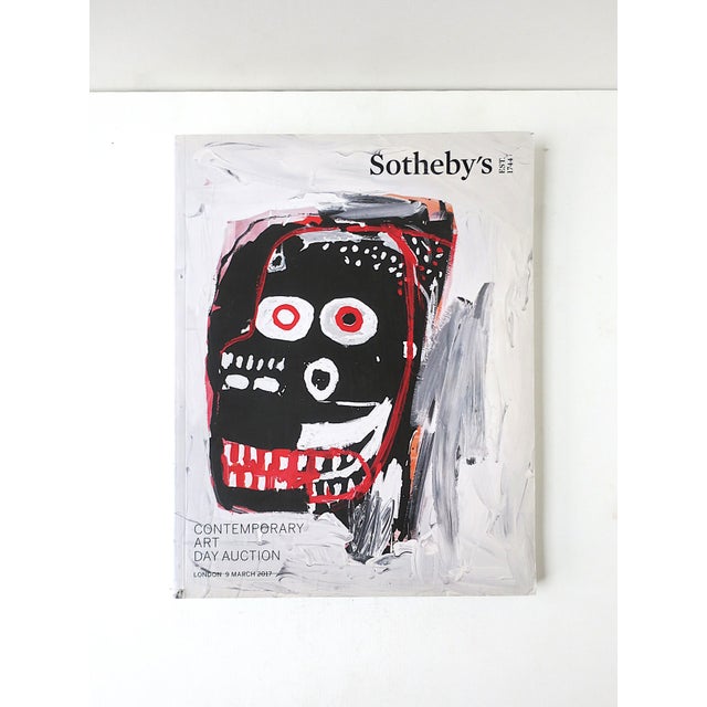A Jean-Micheal Basquiat cover contemporary art catalog book, Day Auction, Sotheby's London, 9 March, 2017. A beautifully...