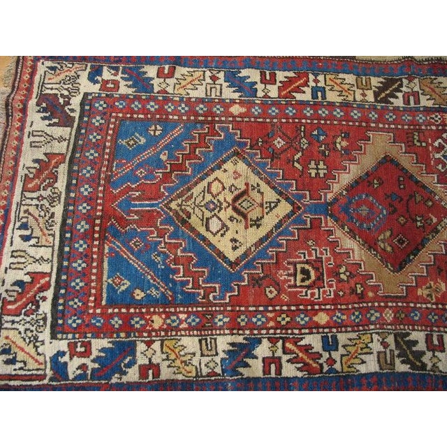 Antique Kurdish Persian Coral 1930s Rug, Circa Date: 1930s. This exceptional piece exemplifies the robust character of the...