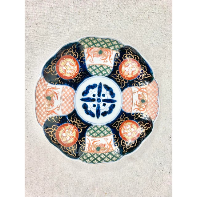 Antique Imari bowl. Vibrant colors and intricate design. Features birds, dragons and geometric designs. A stunning piece...