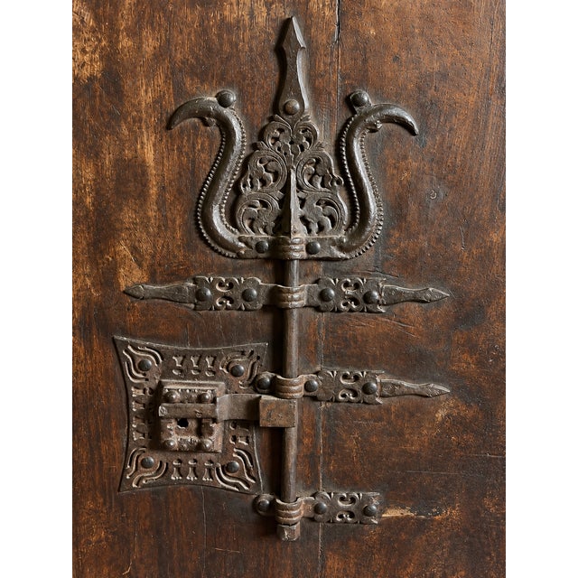 An extraordinary example of early Spanish architectural ironwork, this monumental wrought-iron locking assembly is...