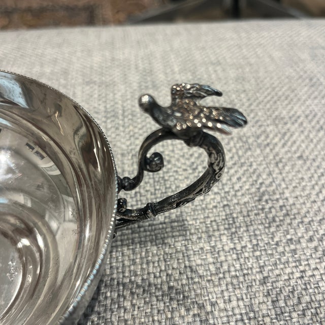 Beautiful decorative sterling silver bowl with detailed edge and a bird handle detail in the style of Ottoman Empire.