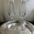 TIFFANY & Co. Set of 2 Champagne Flute Glasses. Tiffany & Co. mark on bottom of each. Both still have their original...