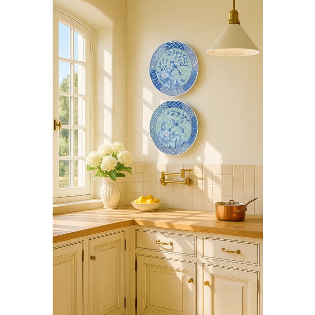 A graceful pair of mid-century Arita porcelain plates, exquisitely hand-painted in Japan circa 1950s–60s. Each piece...