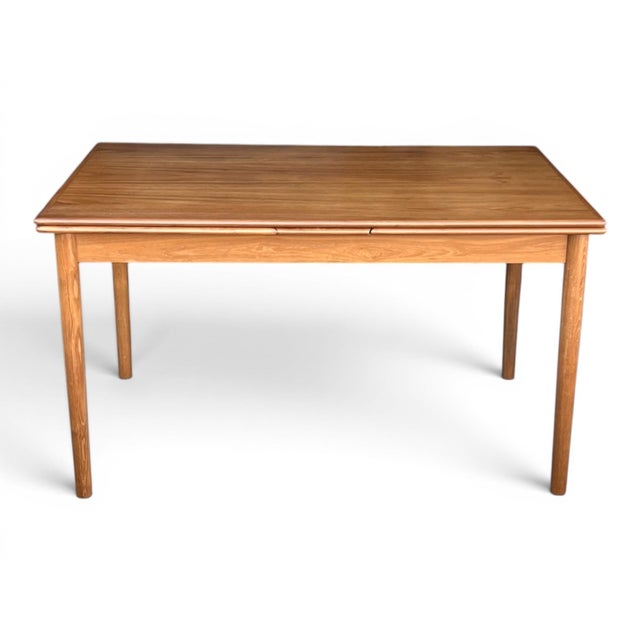 Richly figured teak, ingenious Danish engineering, and timeless Scandinavian design make this Mid-Century Modern dining...