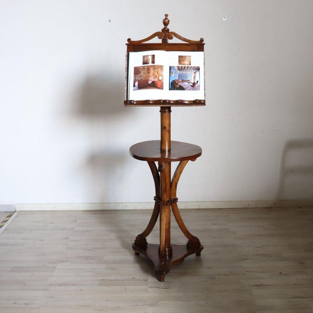 We present this majestic antique italian lectern, crafted from solid walnut and dating back to the early 19th century....