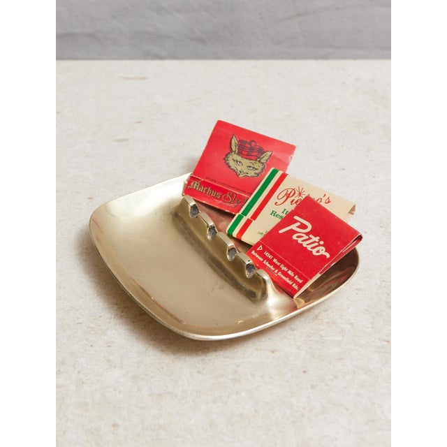 Fabulous mid-century modern solid brass ash tray. Perfect for those that partake. I love it for holding a small collection...