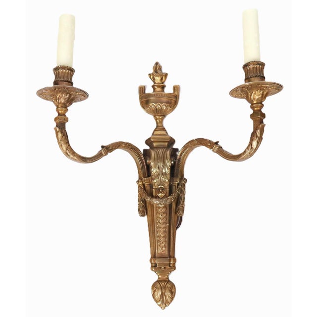 A very finely cast pair of two light French Neoclassical bronze sconces. Lovely French Louis XVI details abound: precisely...