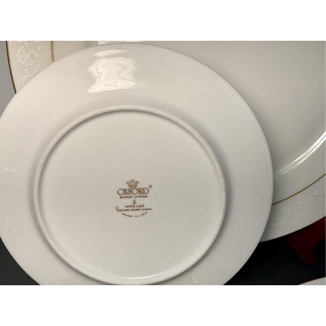 A large, 58-piece set of vintage Oxford Bone pattern “White Lace” bone china dinnerware service for 12 in a `bright...