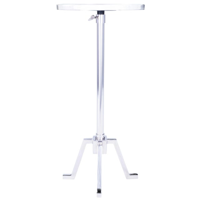 Add interest to your space with this adjustable end table. The chrome finish with a georgeous dark granite top, bring...