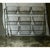 Vintage metal storage rack on casters. Painted green; please see images for detail of surface patina. Nine baskets for...
