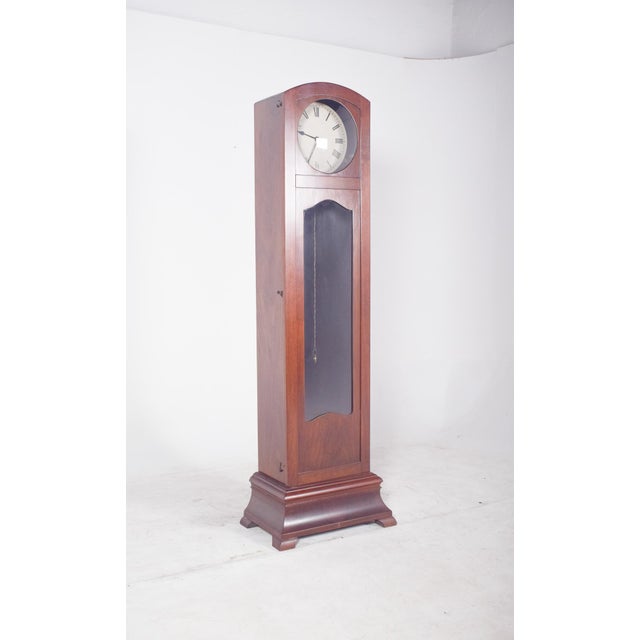 This English box high clock is made of wood.