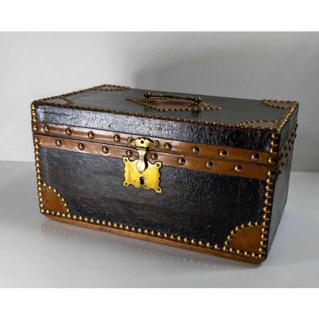 We are selling this great antique French leather document or Coffret box. This box has great look with two tone leather...