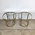 This matching pair of vintage brass and glass side tables features a streamlined design defined by clean lines and...