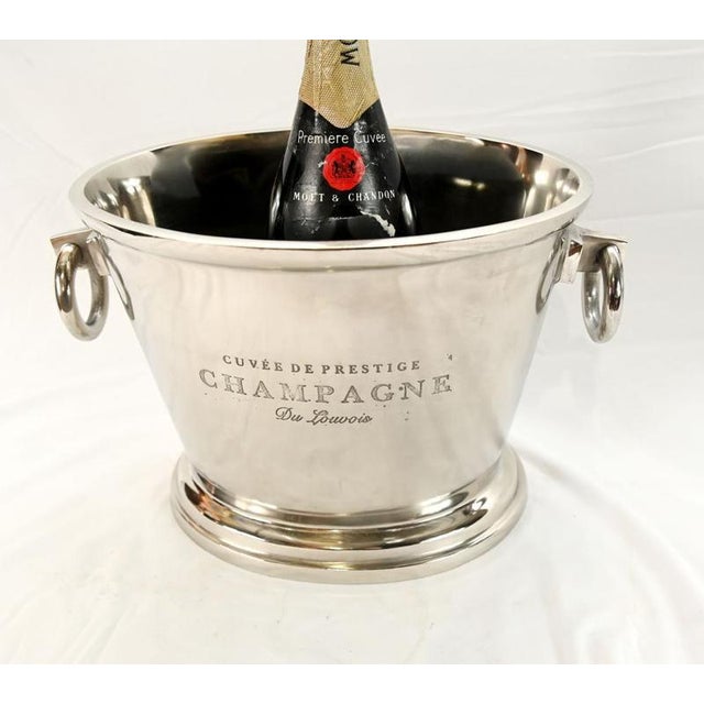 Classic silver plated champagne cooler of traditional form Tapered body with rolled rim and stepped circular base Twin...