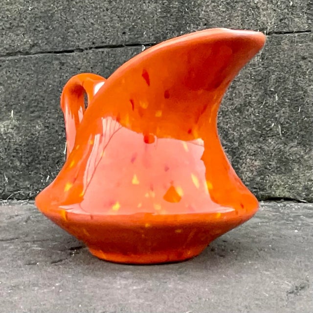 Orange , yellow & red splatter finish adorns this vintage MCM creamer. This creamer has a classic early 1960s silhouette....