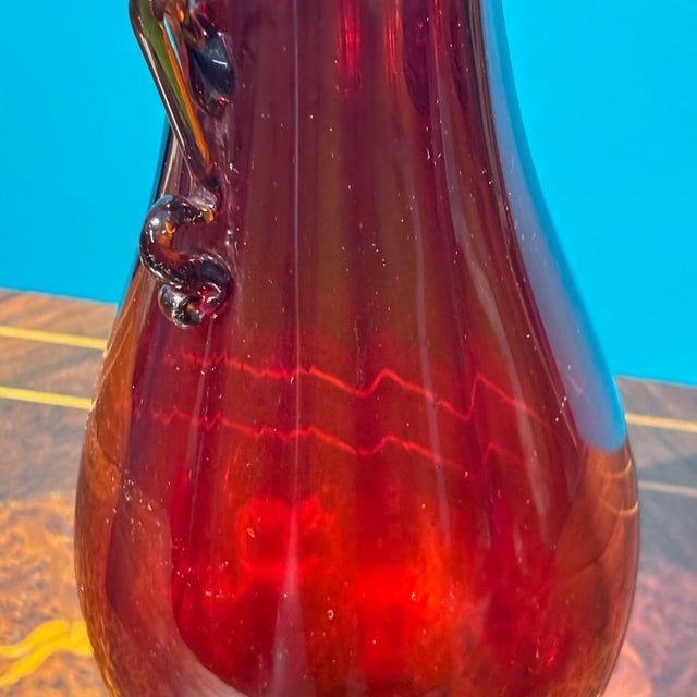 Splendid antique Murano vase from the 1920s. Ruby red, made by Vittorio Zecchin for Cappellin. Height 32 cm, base diameter...