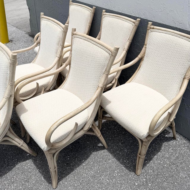 A sophisticated set of six vintage coastal dining armchairs by Whitcraft, blending refined island style with timeless...
