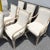 A sophisticated set of six vintage coastal dining armchairs by Whitcraft, blending refined island style with timeless...