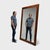 Large enough to fill a wall, this monumental antique mirror makes a statement with its impressive scale and beautiful...