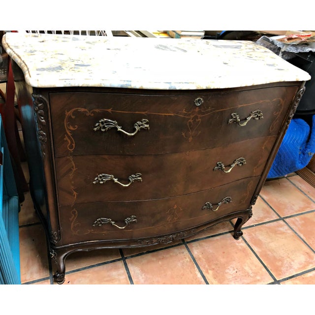 This stunning 19th Century French 3 Drawer Commode, original brenche marble top with yellow and lilac-gray shades, would...