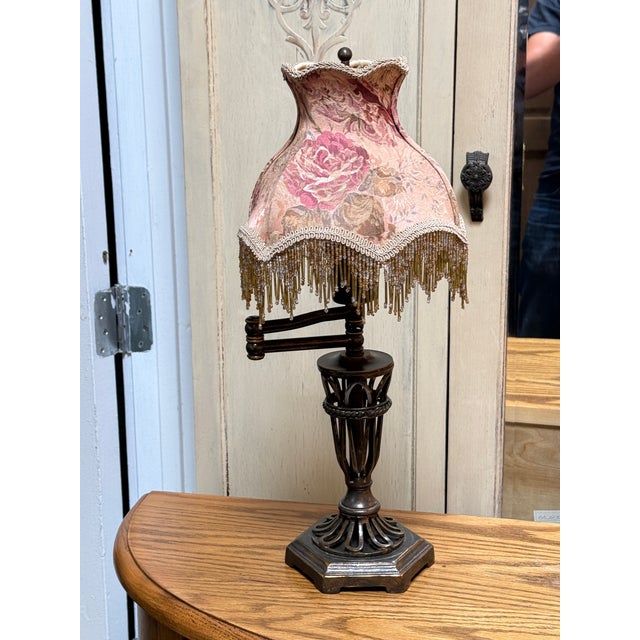 Design Plus Gallery presents a Swing Arm Table Lamp with Beaded Fringe Shade. This vintage style boudoir table lamp has an...