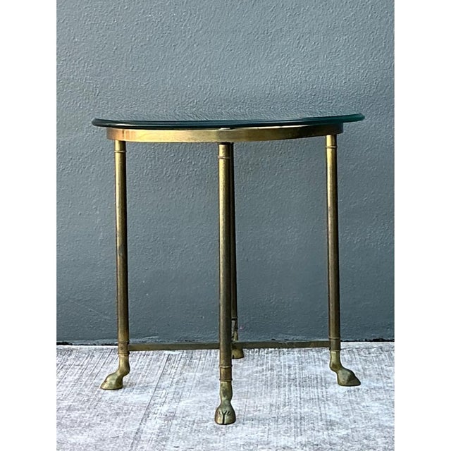 This vintage side table pairs Mid-Century Modern design with a solid brass frame and elegant hoof feet, lending a refined,...