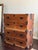 A well-preserved pair of antique Japanese tansu chests, featuring classic Meiji-style construction with warm, richly...