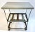 Vintage industrial steel table on casters with removable top. Steel strap middle tier shelf. No maker's marks.