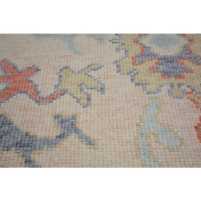 Hand-knotted with care using traditional rug-making techniques, this wool rug blends timeless craftsmanship with a modern...