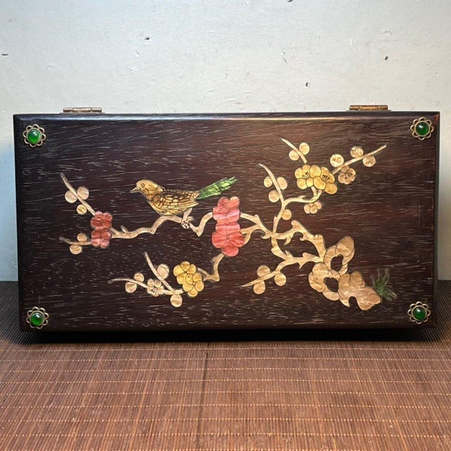 An elegant and richly colored vintage Chinese hardwood jewelry box, crafted from dark, dense Blood Sandalwood. The lid is...