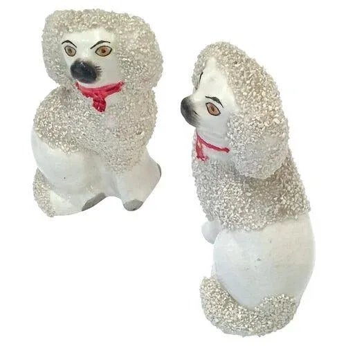 Pair of antique English Staffordshire poodles with red collars and tags. No maker's mark.