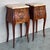 About the Item A pair of Antique French Louis XV Marquetry marble top nightstands. Subtle contours and scroll shapes are...